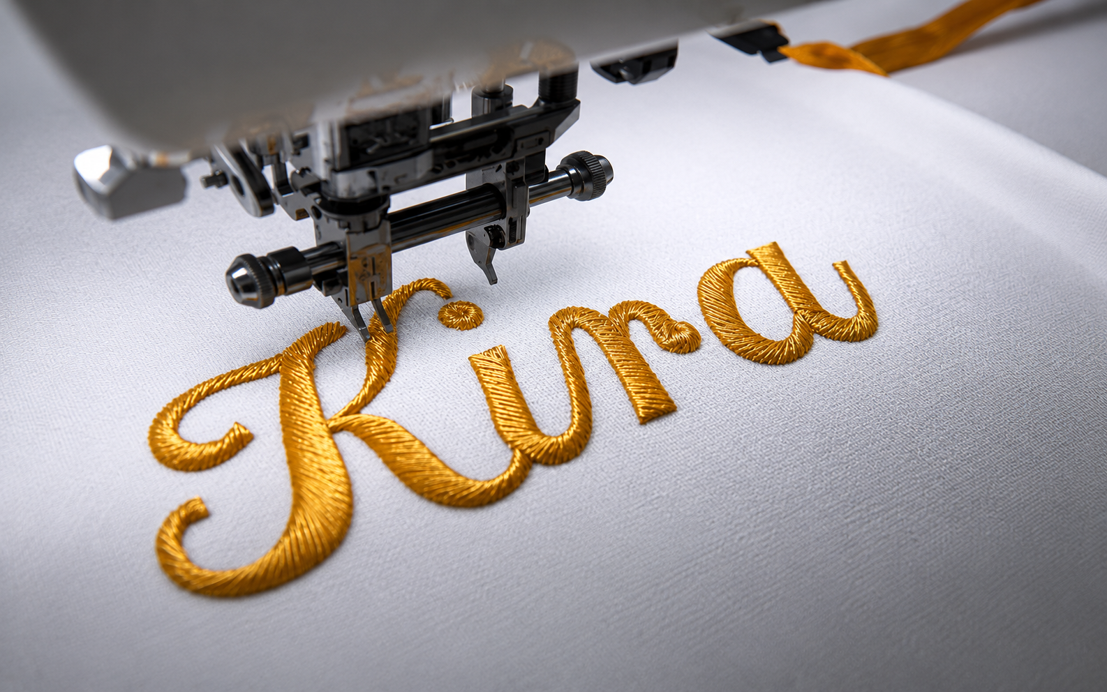 Prompt 29 — Macro shot of embroidery machine stitching a company logo onto navy polo fabric, individual thread detail visible